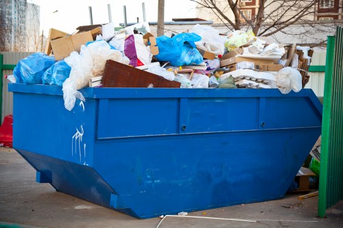 Workers sorting recyclables at a Hertford transfer station