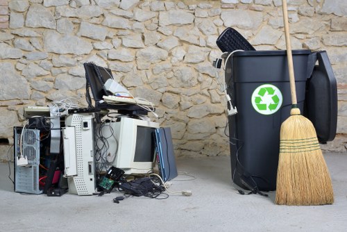 Waste collection crew preparing bins for pickup