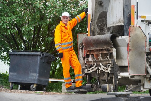 Operators segregating commercial rubbish at a depot